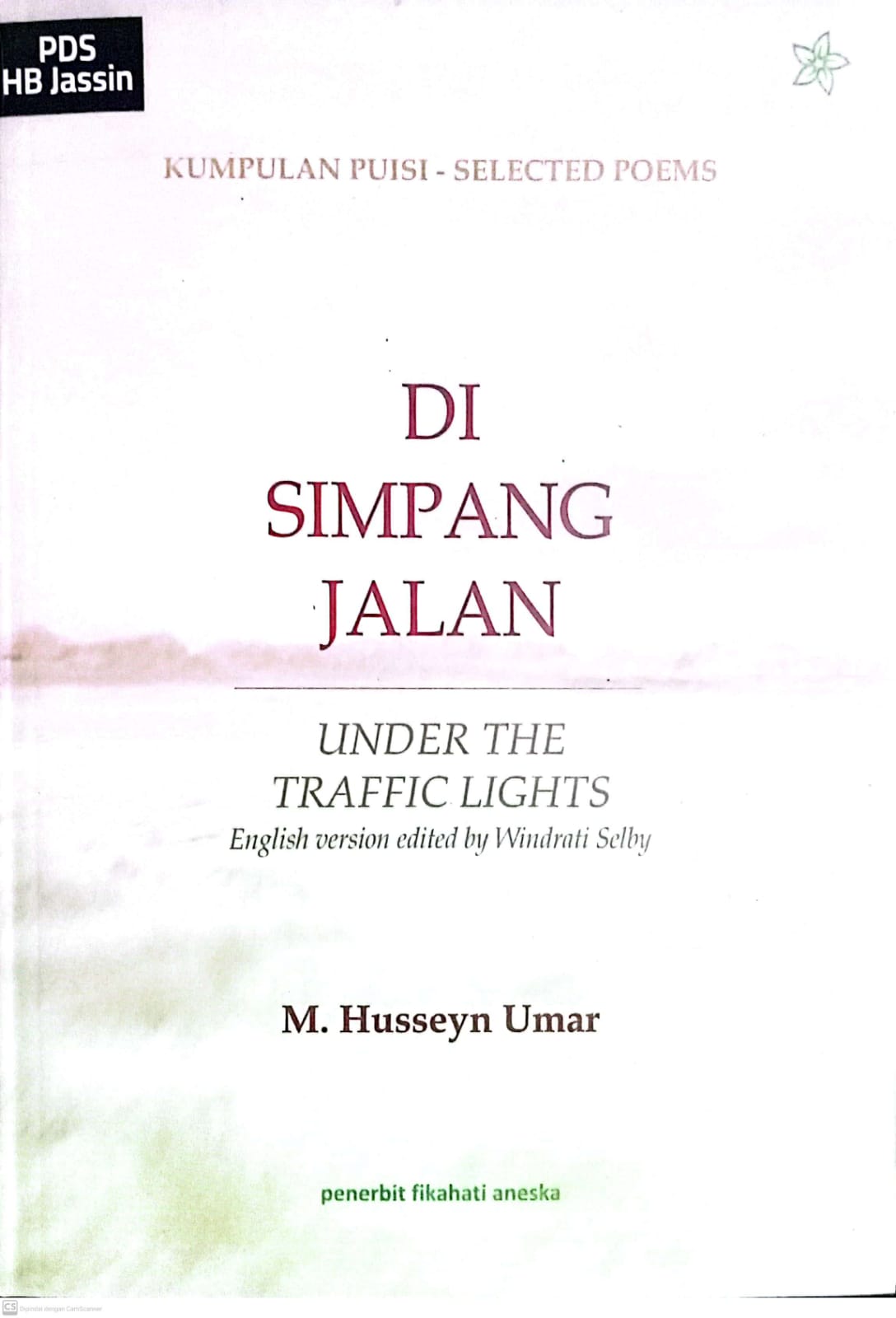 Di simpang jalan :  Under the traffic lights